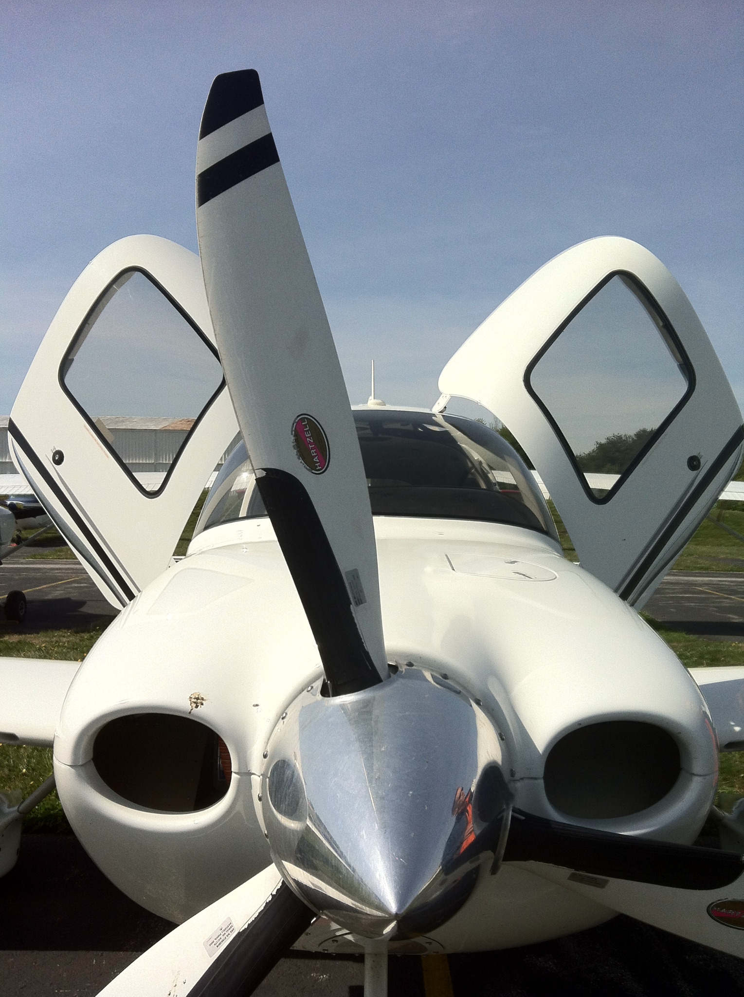 Small aircraft viewed from the front with its doors open