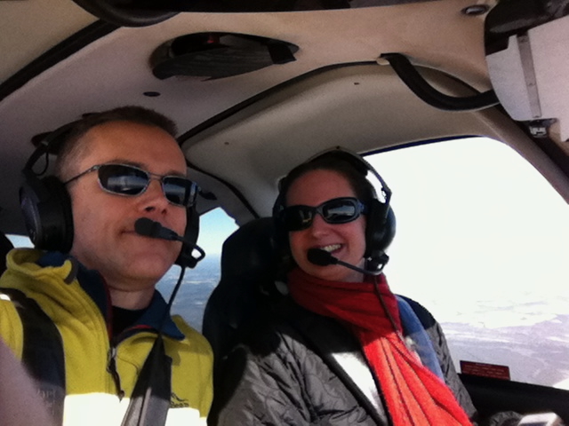 Two people together inside a small aircraft